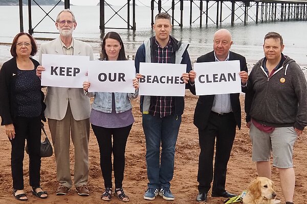 Steve Darling and local Lib Dem activists protesting sewage dumping